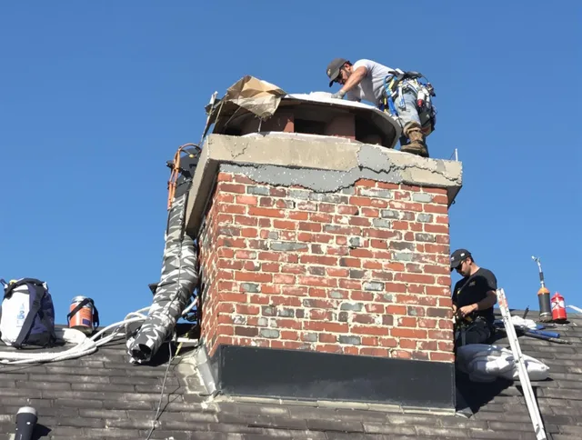 Upland Chimney Sweep installing a custom chimney crown in Upland, CA