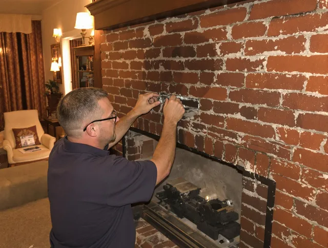 Upland Chimney Sweep expert fixing a fireplace in Upland, CA